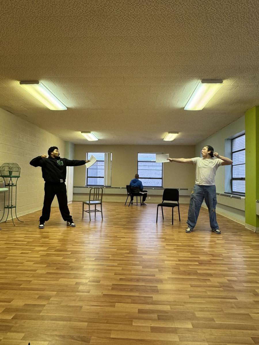 Two actors in a dueling scene, scripts extended, at WCS Actor's Studio