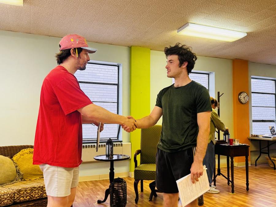 Actors shaking hands during a scene at WCS Actor's Studio